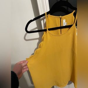 Women’s yellow tank top size large.